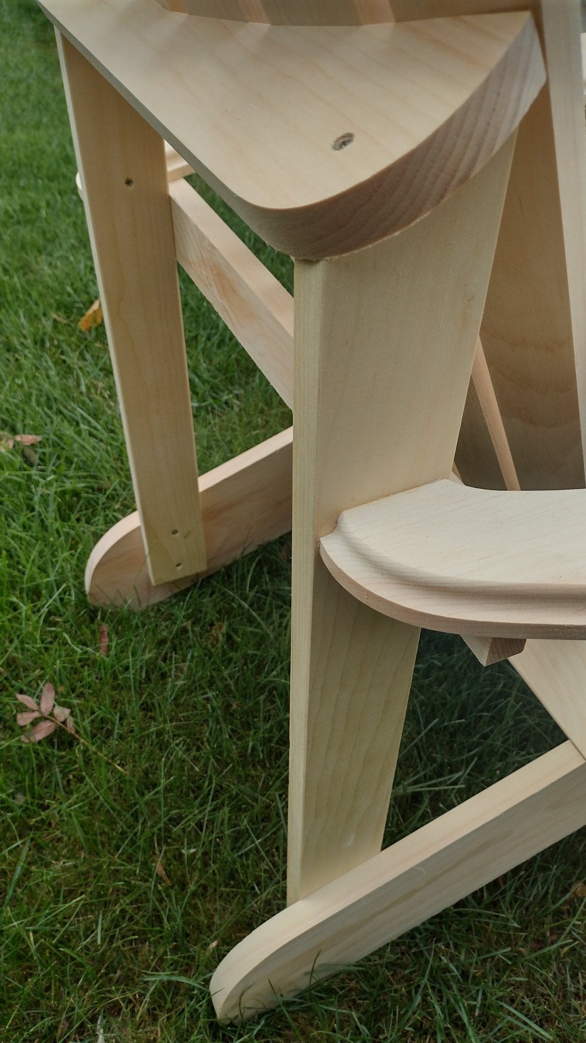 Close-up of Adirondack chairs made from cedar, showcasing craftsmanship and durability for outdoor use.