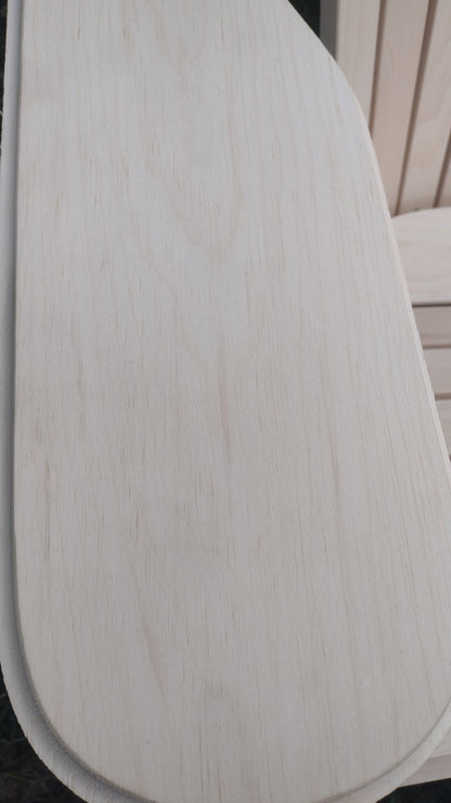 Close-up of the smooth wooden surface on a patio adirondack chair, highlighting its natural grain and finish.